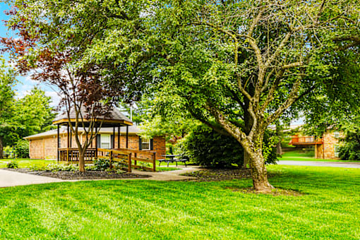 Outdoor gazebo at Fairington Apartments in Columbus, Indiana, surrounded by landscaped greenery.