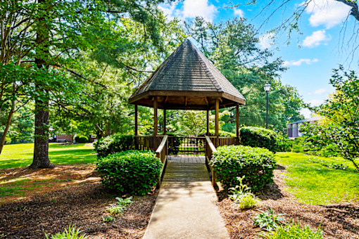 Outdoor gazebo at Blairwood Apartments in Louisville, surrounded by trees and landscaped grounds.