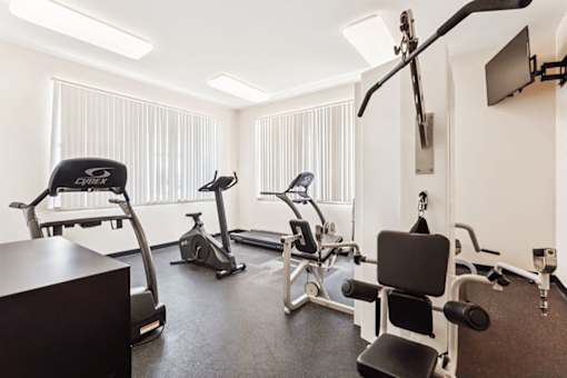 A well-equipped gym with a variety of exercise machines.