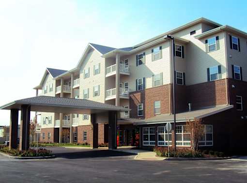 A large apartment complex with a covered walkway.
