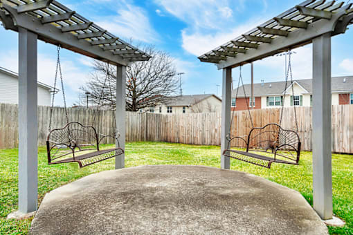 Patio swings at Briarwood Apartments in Lexington.