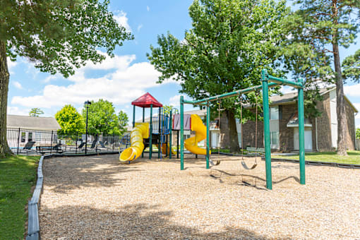 Playground with slides and swings at Northwood on the Trail.