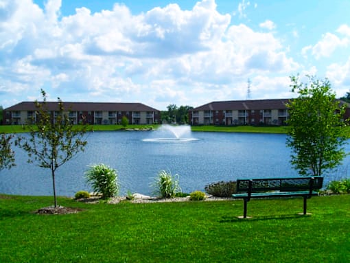 Pond with a fountain at North Lake Apartments.