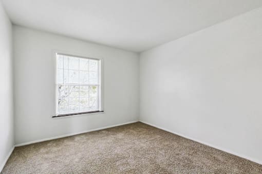 Primary bedroom in a two-bedroom apartment at Carriage House Apartments, Muncie, IN