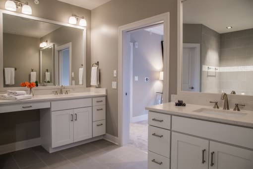 Luxury Penthouse Master Bathroom with Two Vanities at Quarry at River North Apartments, Indianapolis