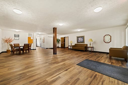 Social lobby at Fairington Apartments in Anderson, featuring seating and a welcoming atmosphere.