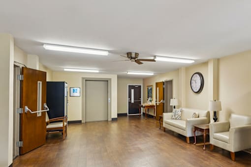 Social lobby at Fairington Apartments in Columbus, Indiana, featuring seating.