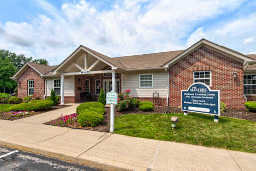 A brick building with a sign that says "Masters" on it.