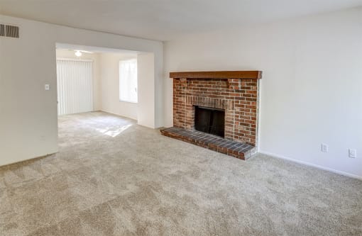Townhome Living Room with a fireplace at The Woods of Eagle Creek