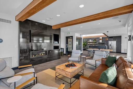 Modern living room with fireplace and wood beams at The Lyric Apartments, Washington, 98102