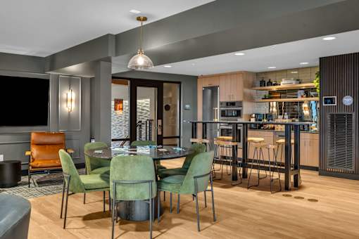 Open dining and kitchen space with modern furnishings at The Lyric Apartments, Seattle, Washington