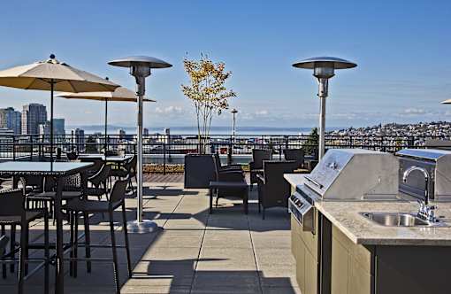 Rooftop outdoor kitchen with grill and sink at The Lyric Apartments, Seattle, Washington