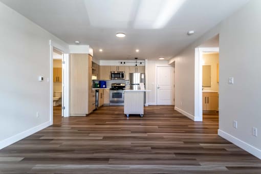 Spacious living area with open kitchen layout at The Lyric Apartments, Washington, 98102