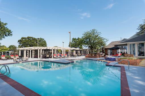 A large swimming pool with a red and white border.
