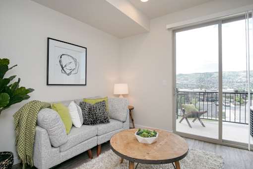 Modern living room with balcony access at Liberty Point Apartments, Draper, Utah