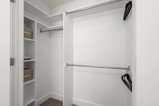 Walk-in closet with shelving and dual rods at Liberty Gateway Apartments, Utah