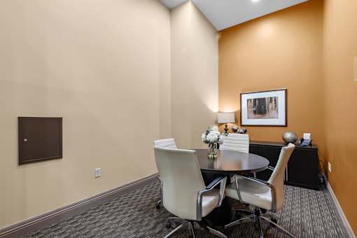 Conference room with round table and modern chairs at Liberty Gateway Apartments, Salt Lake City