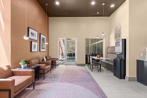 Community lounge with dining table and seating at Liberty Gateway Apartments, Utah