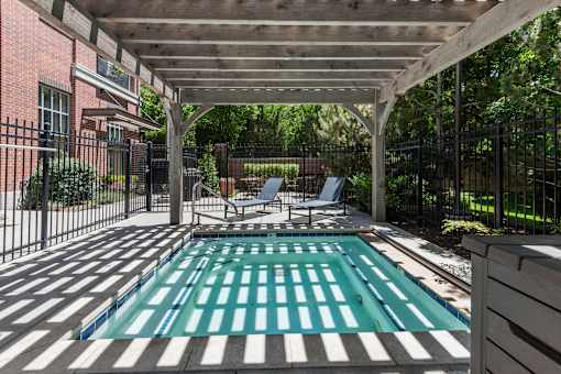 Swimming pool under pergola with lounge chairs at Liberty Gateway Apartments, Salt Lake City, 84101