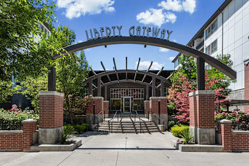 Property entrance with arched metal signage at Liberty Gateway Apartments, Utah, 84101