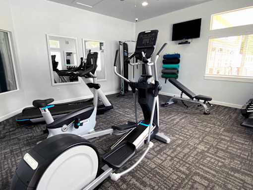 Fitness center with cardio and strength equipment at Liberty Hill Apartments, Draper, Utah