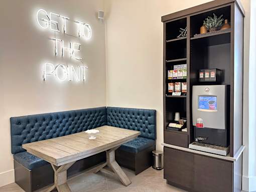 Coffee station with tufted booth seating at Liberty Point Apartments, Utah, 84020