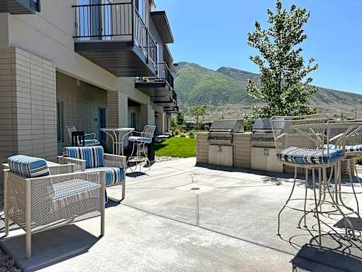 Outdoor patio with bbq grills and seating at Liberty Point Apartments, Draper, UT