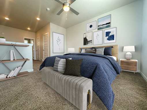 Contemporary bedroom with navy bedding and gallery wall at Liberty Point Apartments, Draper, Utah