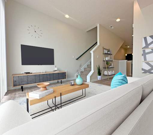Contemporary living room with staircase and tv at Liberty Point Apartments, Draper, UT 84020