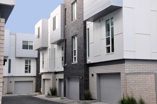 A modern residential building with white and grey exterior at Liberty Square Apartments - Saltlake City, UT Apartments, Utah, 84102