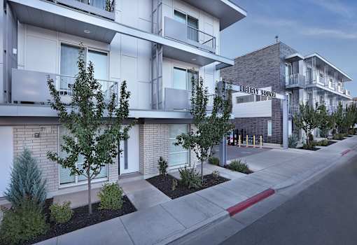 sidewalk and trees in front of it at Liberty Square Apartments - Saltlake City, UT Apartments, Apartments, Saltlake City, UT