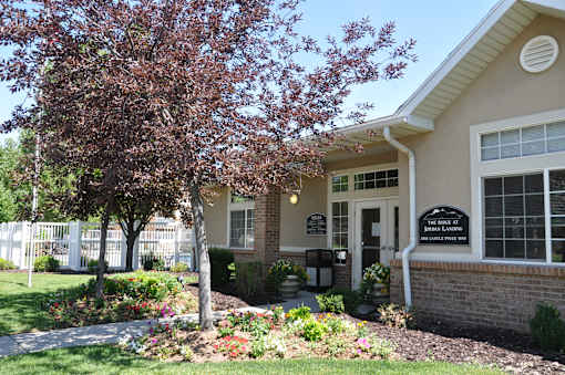 A small building with a sign that says "The Sidekick" in front of it.