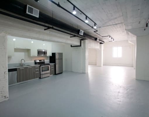 a large room with sinks and appliances in it at Binford Lofts Apartments, Los Angeles 