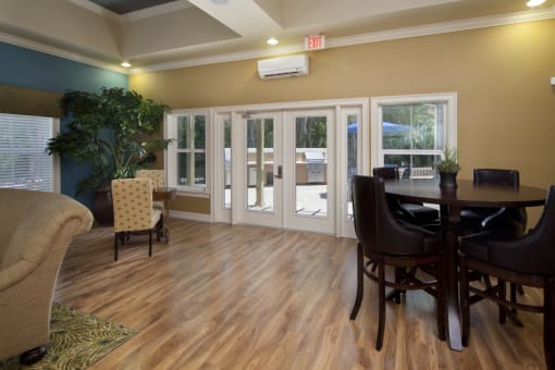 A room with a brown chair and a brown table.