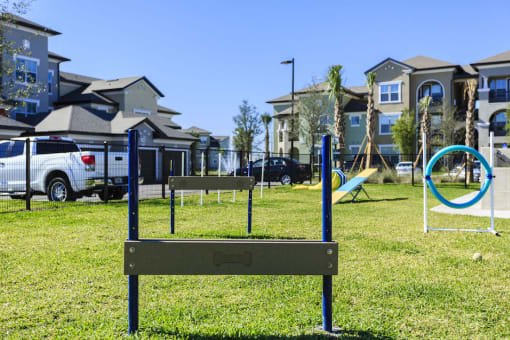 Hurdle at pet park for dogs to jump over at Lake Nona Water Mark in Orlando, FL 32827