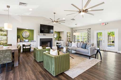 A living room with a fireplace and a television.