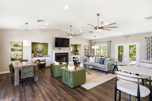 A living room with a fireplace and a television.