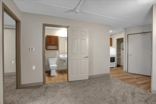 a living room with a toilet and a bathroom