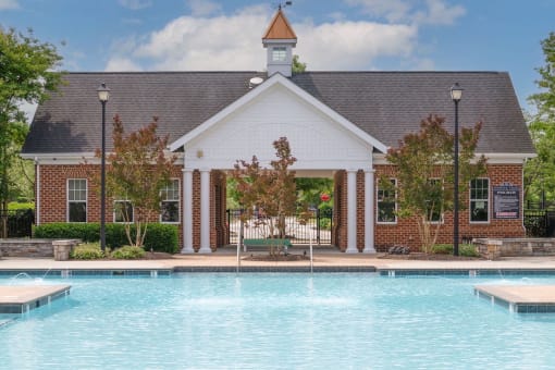 large beautiful pool in front of building at Fenwyck Manor Apartments in Chesapeake, VA