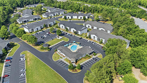 A bird's eye view of a resort with a swimming pool.
