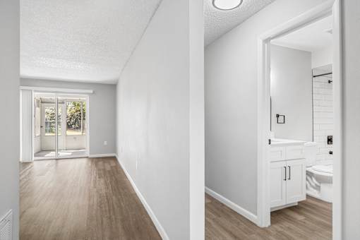 A white bathroom with a toilet and sink.