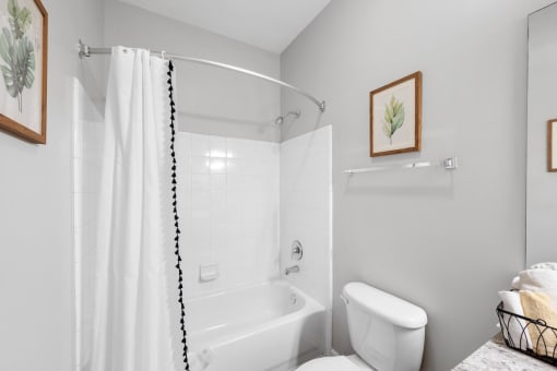 a bathroom with a bathtub and a toilet