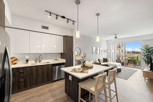 A modern kitchen with a dining table and chairs.