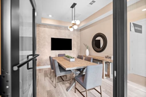 a dining room with a table and chairs