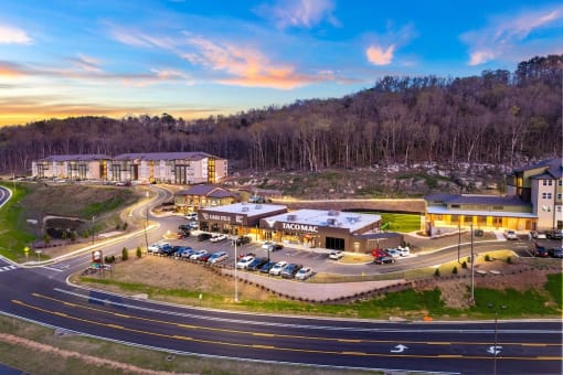 an aerial view of a hotel with a road in front of it