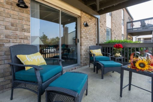 spacious balcony with sliding glass entrance and model furnishings and decor at The Onyx Hoover Apartments