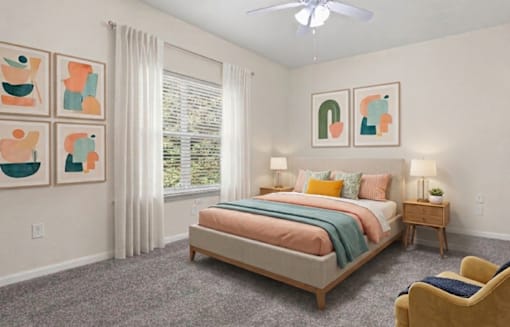 A bedroom with a bed, two lamps, a chair, and a ceiling fan.
