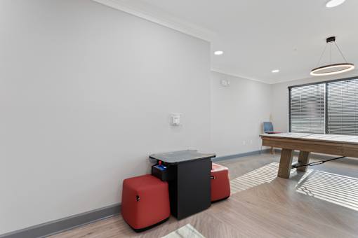 a game room with a ping pong table and a pool table