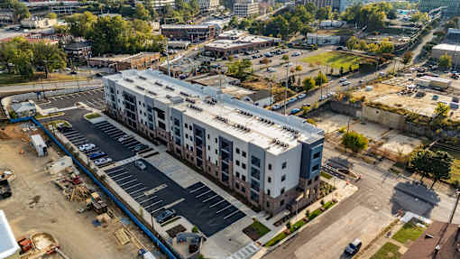 an overhead view of an apartment building in a city