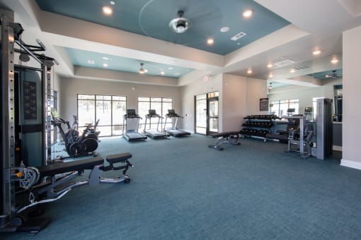 Canopy Park's massive fitness center with cardio and strength training equipment at Canopy Park Apartments, Pelham Alabama